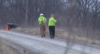 An image showing fber optic strand being pulled along a Missouri dirt road.