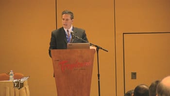 Alan Plott of NetAmerica Alliance speaking at the 2015 Wireless Symposium.
