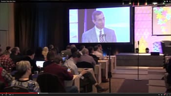 A screenshot of the audience and stage at the 2015 ACA Summit.