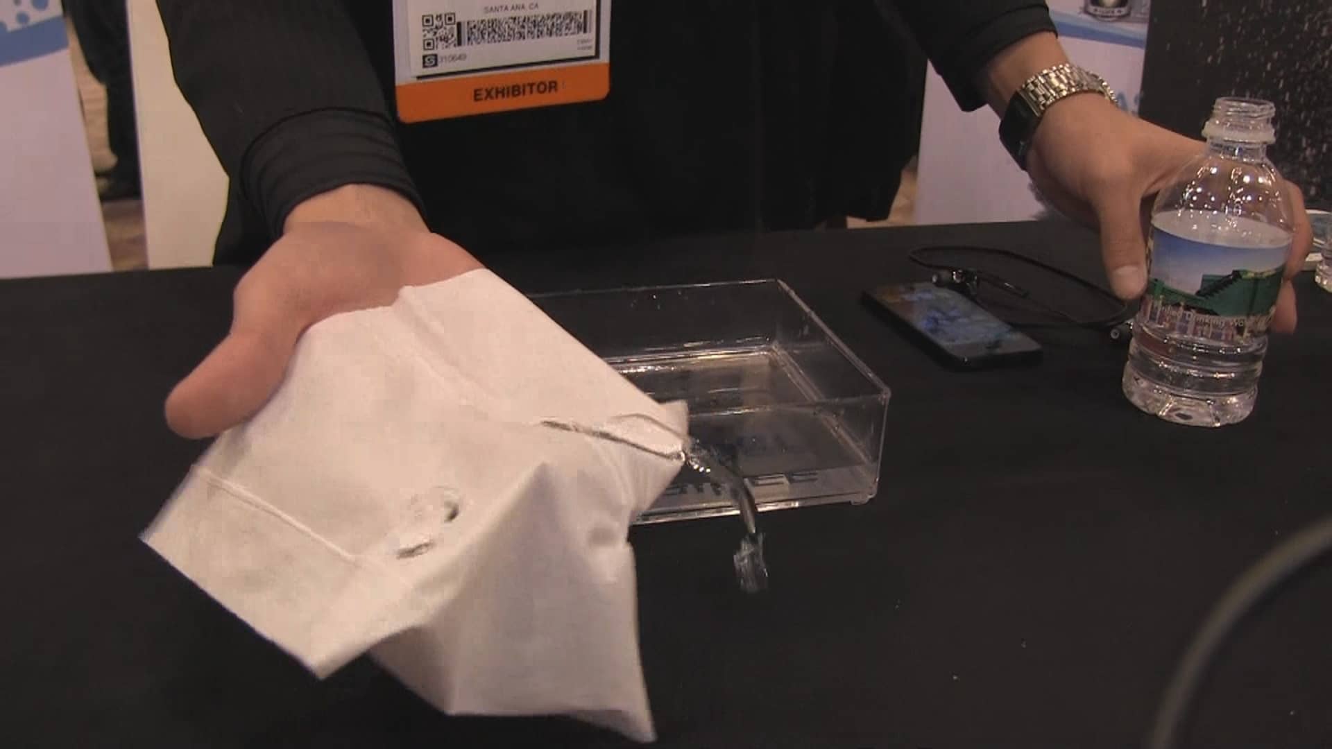 A demonstration of material that prevents water from damaging electronics.