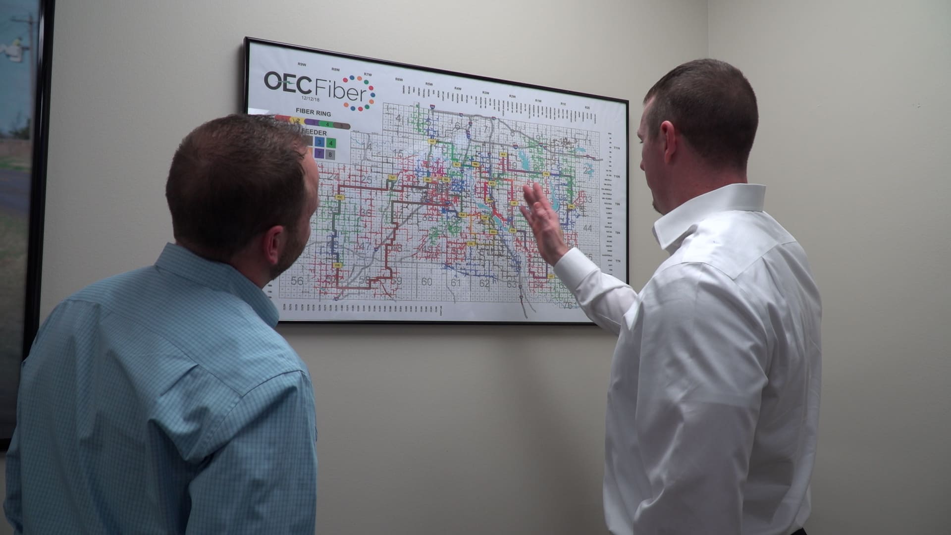 A map on a wall depicting OEC Fiber's service area.